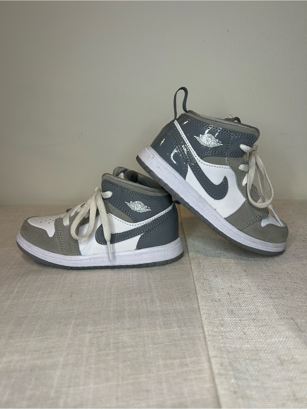 Nike Air Jordan 1 Mid Kids Grey and White High-Top Sneakers